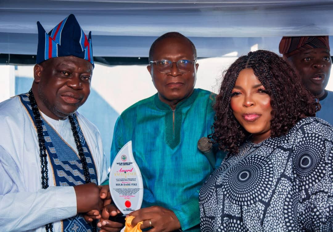 A commemorative plaque being presented during the TIPU Ilorin Branch New Yam celebration