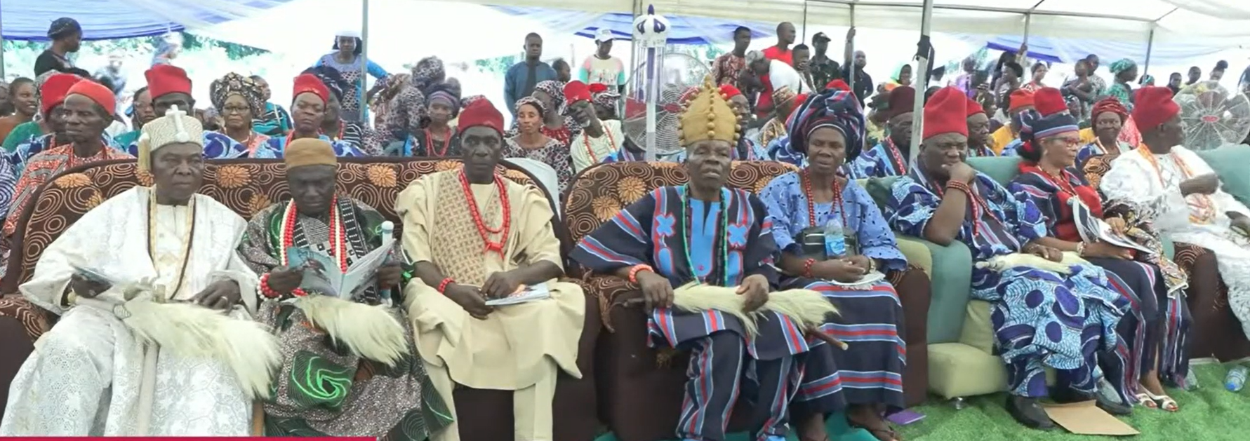 Traditional and community leaders seated together in ceremonial attire at a Takete-Ide gathering
